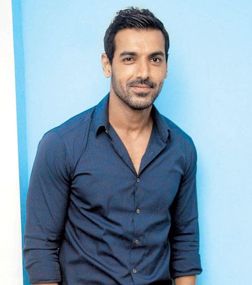John Abraham holds the date