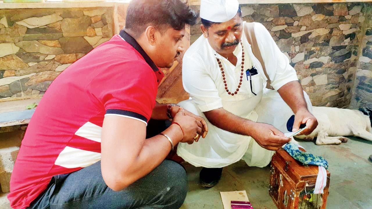 Shatrughan Gupta (in red T-shirt) with the astrologer