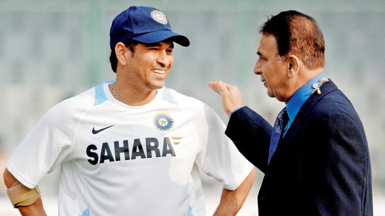 Sachin Tendulkar speaks with Sunil Gavaskar during the opening day of the first Test match between India and West Indies at the Kotla in New Delhi on November 6, 2011. Pic/Getty Images