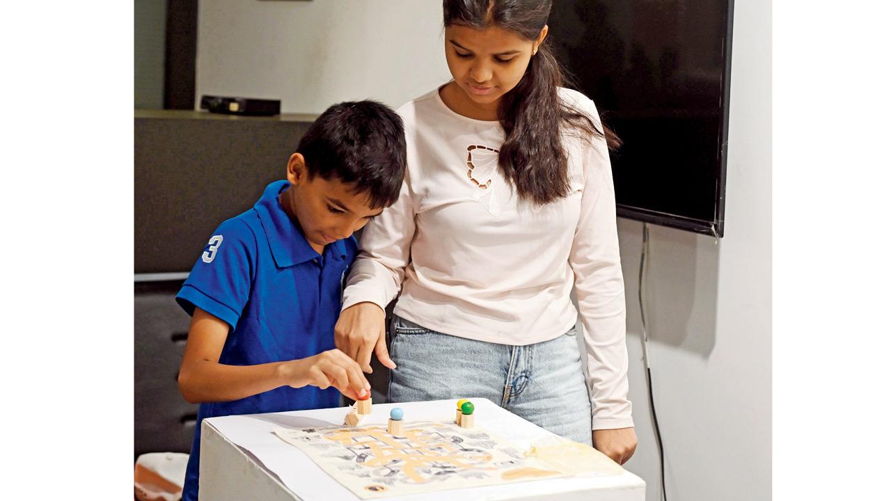 Children try out the board game at the launch