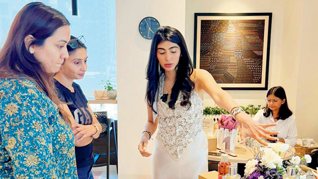 Majithia (right in white) explains scent profiling 