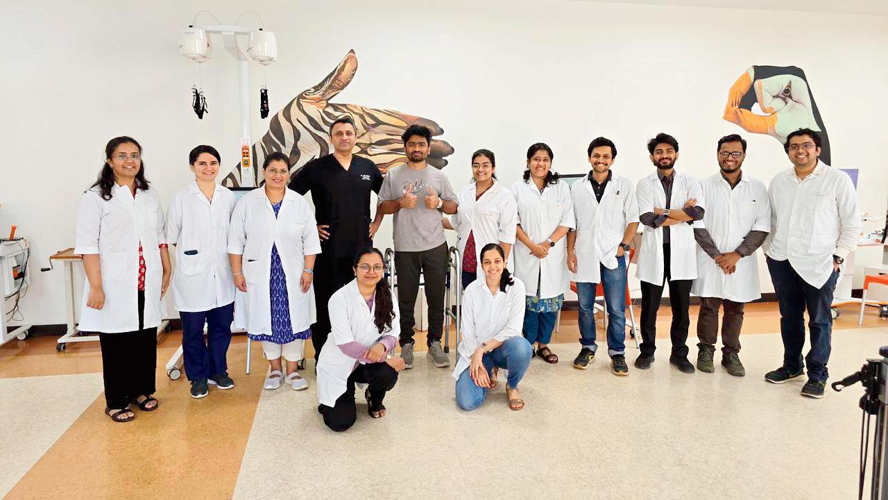 Harsh Jain (grey shirt), who is recovering from paraplegia, stands tall at Jupiter Hospital in Thane. PICS/BY SPECIAL ARRANGEMENT