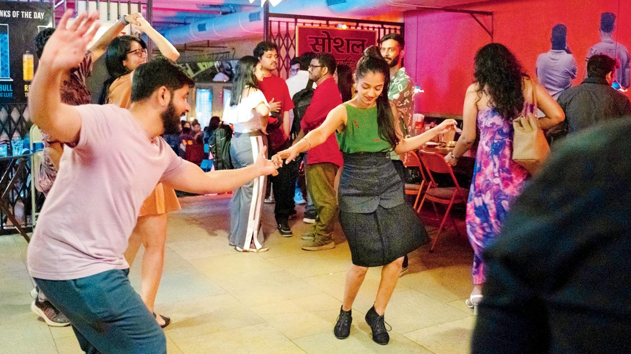 Dancers perform the Swing Out or Breakaway, one of the defining steps of Lindy Hop. Pics courtesy/Slingshot Swing