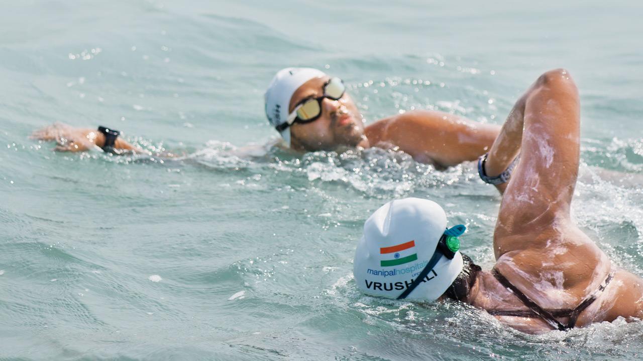 The couple, who only learned to swim four years ago, covered a staggering 22 kilometres