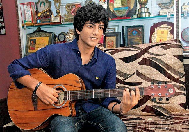 Palash Muchhal strums his guitar at his Andheri residence and (below) Palash at his studio	Pics/Ronak Savla