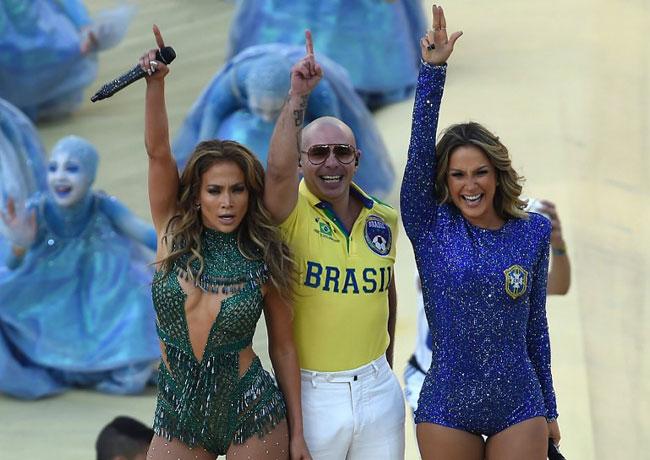 Rapper Pitbull with Brazilian pop singer Claudia Leitte and Jennifer Lopez salute the audience at the opening ceremony of the 2014 FIFA World Cup at the Corinthians Arena in Sao Paulo