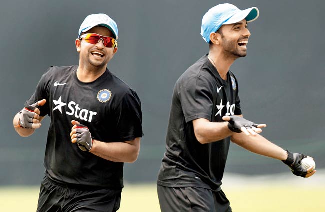 Suresh Raina (left) and Ajinkya Rahane have a laugh during a practice session in Dhaka on Saturday. Pic/AFP