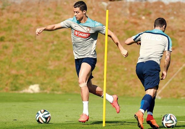 Portugal striker Cristiano Ronaldo (left) takes part in a training session at the Campinas on Saturday. Pic/AFP