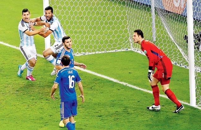 Argentina players celebrate an own-goal by Bosnia