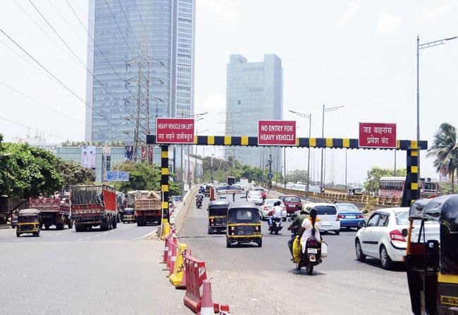 The metal gantry that blocked the entry of heavy vehicles on the Dindoshi flyover is missing. The two pillars are its only remnants. File pic