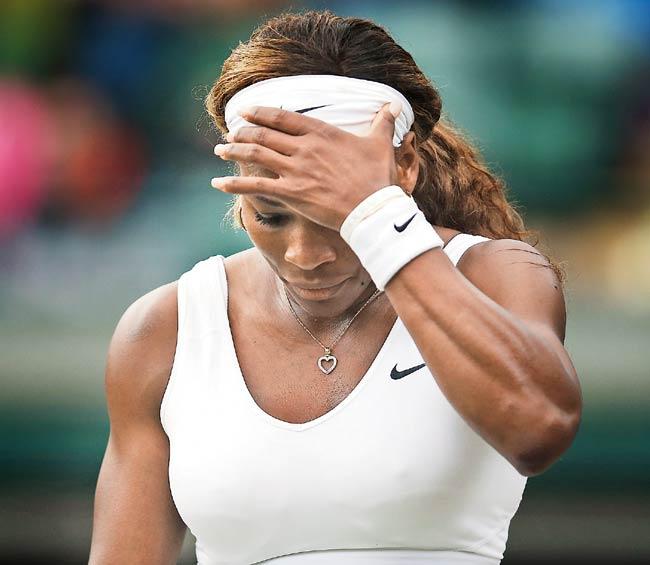 Top seed Serena Williams reacts during her third round Wimbledon match to Alize Cornet on Saturday. Pic/Getty Images