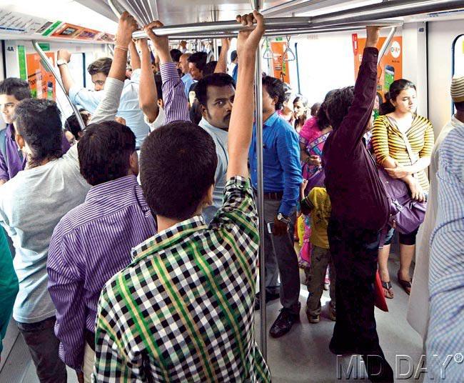 Women commuters in the metro prefer to stand in a corner during peak hours