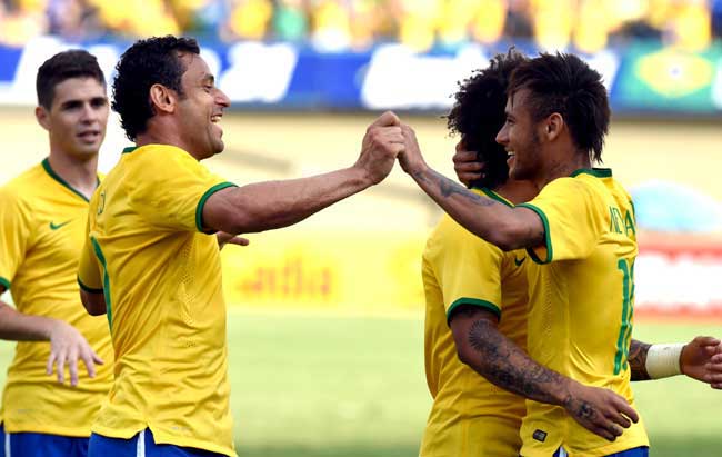 Brazilian players celebrates a goal scored by Forward Neymar (R) in a friendly football match against Panama as preparation for the FIFA World Cup Brazil 2014, at Serra Dourada Stadium. Pic/AFP