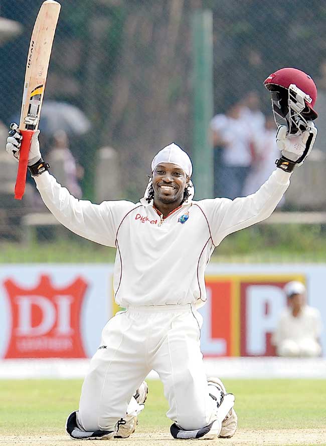 Chris Gayle celebrates his 300 on Day Two of the first Test vs SL at Galle on November 16, 2010. Pic/AFP