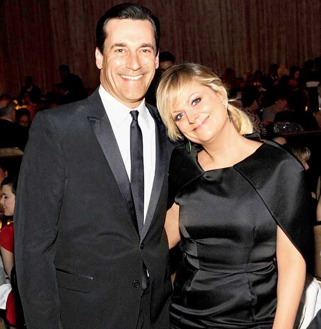 Jon Hamm and Amy Poehler comfortably juggle between TV and films. Pic/AFP