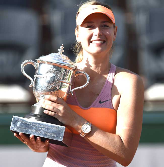 Maria Sharapova holds the Suzane Lenglen trophy after winning the French Open final against Romania