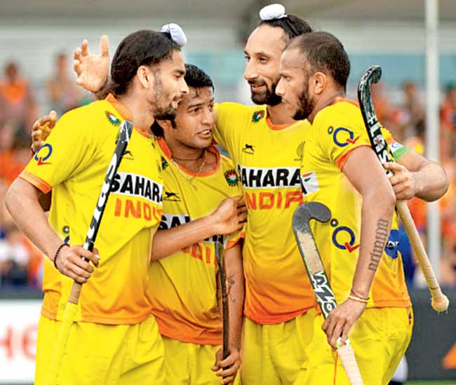 Akashdeep Singh is congratulated by his teammates after their 3-2 win over Malaysia on Saturday.