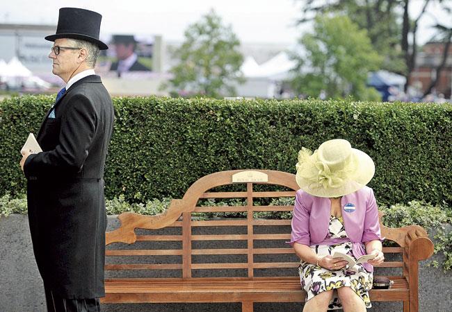 Race-goers attend the annual Royal Ascot horse racing event near Windsor, Berkshire, The five-day annual fusion of high-end fashion and top-class racing is one of the highlights of global horse racing and the pinnacle of the English social calendar. Pic/AFP