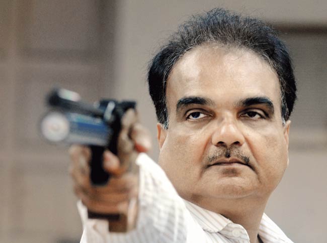 Shooter Ashok Pandit says it is a conspiracy by Shaikh and Vasai MLA Vivek Pandit, who he says have been eyeing MRA land worth Rs 300 crore in Worli. File pics