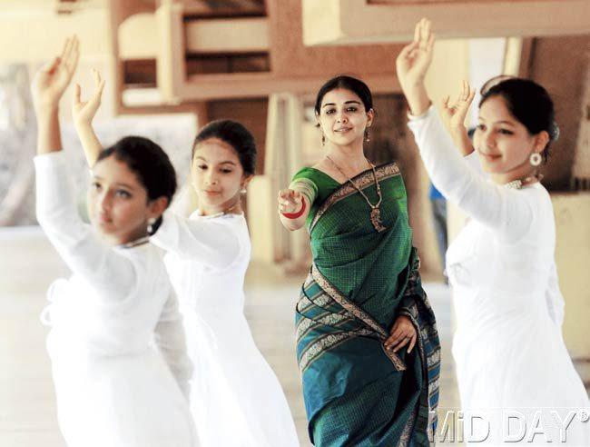 Dancers get guidance from their teacher Sanjukta Wagh as they master their moves