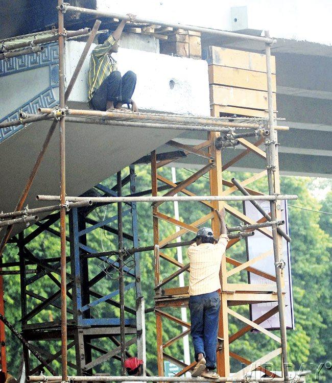 All through the day, labourers were seen working on different parts of the flyover