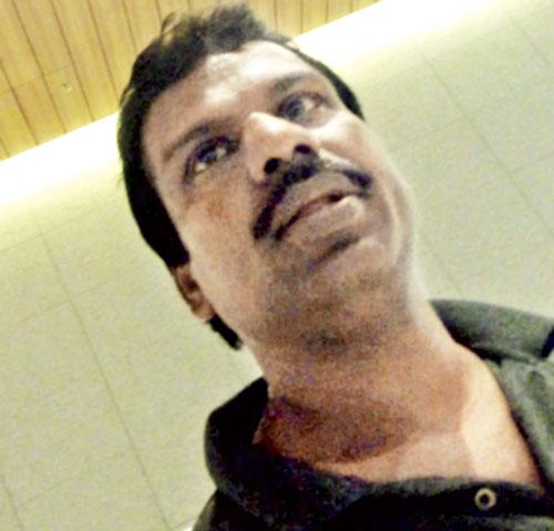 Kailash Kamble, who works in T2 as a ground handler, was caught on camera by a mid-day reporter