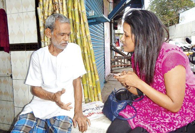 Chendwankar talks to a stranger as part of her project