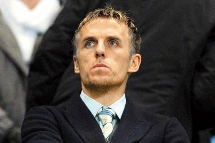 Phil Neville takes wife, kids to Barbados beach to overcome coaching woes at Man United