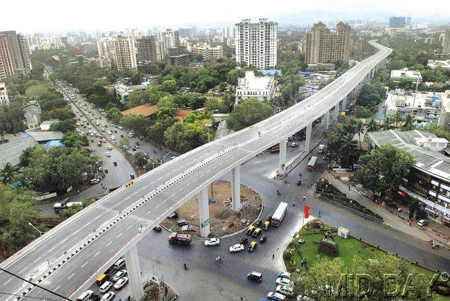 Motorists had another reason to rejoice yesterday. Chief Minister Prithviraj Chavan also inaugurated the 2.8-km Panjarpol-Ghatkopar Link Road (PGLR), thereby completing the 16.4-km long Eastern Freeway.  The elevated road is now the highest bridge in the city, standing tall at a height of 22 metres. It will enable people from the Eastern suburbs and Thane to go towards south Mumbai in about 30 minutes. Motorists will now drive far above the traffic snarls at various bottlenecks.   The 2.8-km Panjarpol-Ghatkopar Link Road will enable people from the Eastern suburbs and Thane to go towards south Mumbai in about 30 minutes. Pic/Atul Kamble  Addressing the media after the inauguration of PGLR, CM Prithviraj Chavan said, “I am very happy to present the southbound arm of the Kherwadi flyover and the Panjarpol-Ghatkopar Link Road to Mumbaikars. Both these projects will certainly change the way Mumbaikars travel.”  “The completion of this road will enable motorists to use the entire Eastern Freeway and help them cruise over traffic congestions at Dadar, Sion, Chembur, Kurla and Mankhurd. The completed Eastern Freeway is now expected to carry 65,000 vehicles every day”, said UPS Madan, metropolitan commissioner, MMRDA.  “The MMRDA has, in the last five years, delivered projects worth more than Rs 15,000 crore and is implementing various projects worth Rs 10,000 crore. The authority will also be undertaking projects worth Rs 36,000 crore, including the Colaba-Bandra Seepz Metro Line-3, Mumbai Trans-Harbour Link, Surya Water Project and Worli-Sewri corridor,” the Chief Minister informed during his speech.   The CM further added that the government is expecting cooperation from the Environment Ministry to launch the Charkop-Bandra-Mankhurd Metro Line-2. “We have raised the related issues with the Union Environment Minister during his recent visit to Mumbai,” he said.