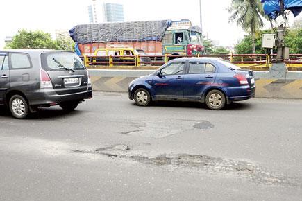 Mumbai: Potholes appear on 'repaired' Dindoshi flyover after first rains