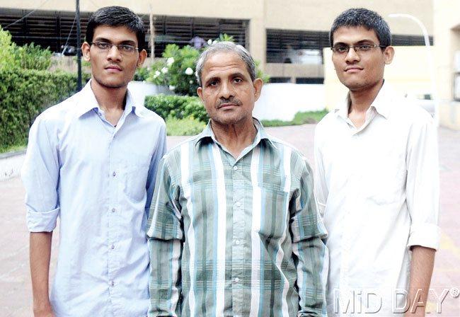 Ramashankar Yadav flanked by his sons Ram (right) and Shyam (left). The brothers said they will ensure that they deliver on the trust reposed in them. File pic