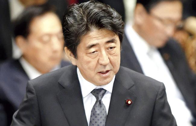 Japanese Prime Minister Shinzo Abe has said that when  Indian PM Narendra Modi visits Japan, the two sides will work to make the Japan-India cooperation peaceful and prosperous . Pic/AFP