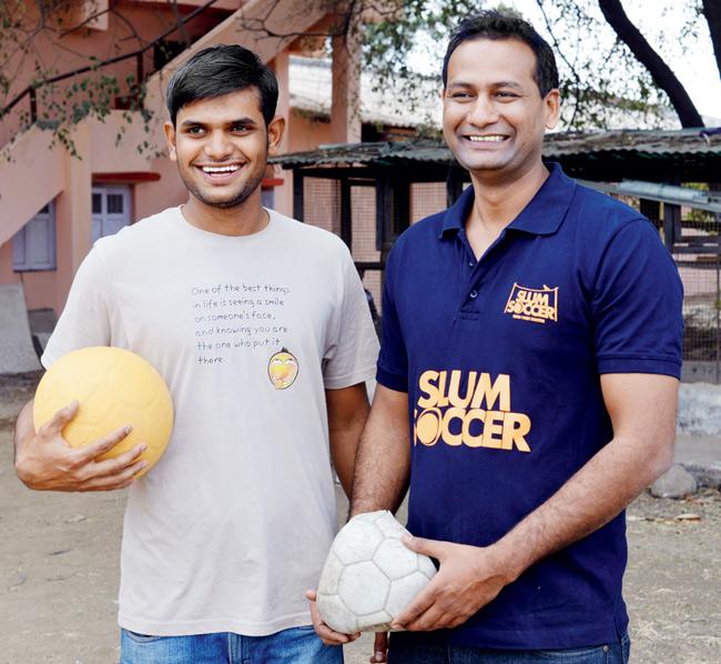 Surandase with CEO of Slum Soccer, Abhijeet Barse