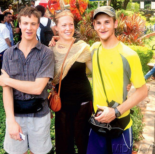 ART OF TOURING: Tourists Henry, Renate and Dariano near the traffic island at Nariman Point. Pic/Bipin Kokate