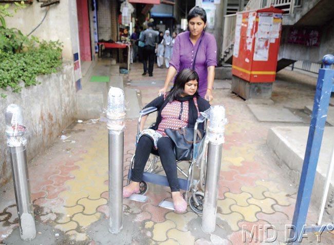 Barricades on the footpath outside Marol Naka station do not have enough space for a wheelchair to pass through
