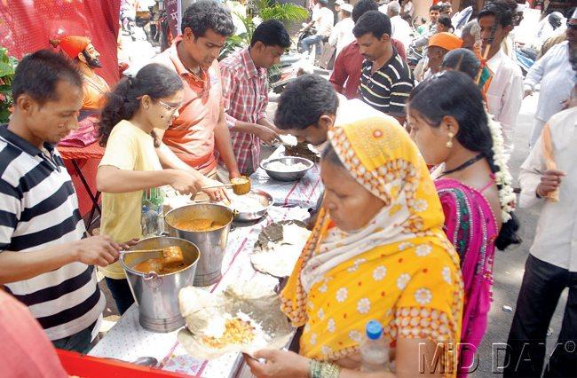 Many ways to serve: Volunteers from various Ganpati mandals collaborate to serve food to the warkaris 