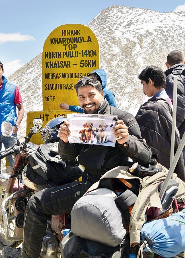 Sushant Ajnikar at Khardung La, Leh, one of the highest routes he rode during the cross-country expedition he undertook for the cause of the stray dogs