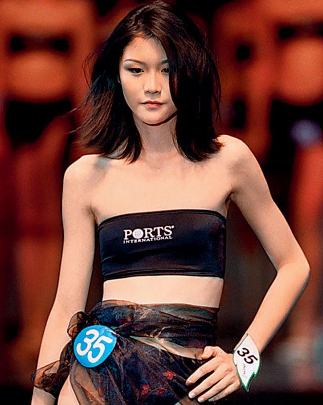 Wang Yang, a 16-year-old high school student from Zhejiang province, walks the ramp at the Shanghai Ascend International Model Competition after she won the golden award in 2000. 170 models from France, Greece, Italy, Norway, Israel, Estonia and the United States had taken part in the contest. 