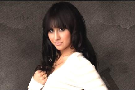 Lauren Gottlieb courts controversy for posing with rifle