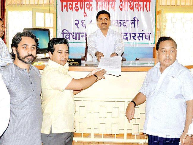 FIGHTING FOR PRIDE: Narayan Rane (far right) and his son Nitesh (in yellow) are contesting from Kudal and Kankavli Assembly constituencies respectively. File pic