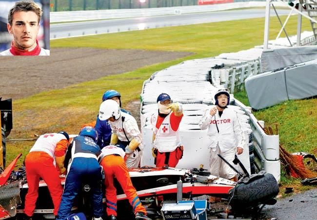 Jules Bianchi (inset) of France and Marussia receives urgent medical treatment after crashing during the Japan GP on October 5. Pic/Getty Images