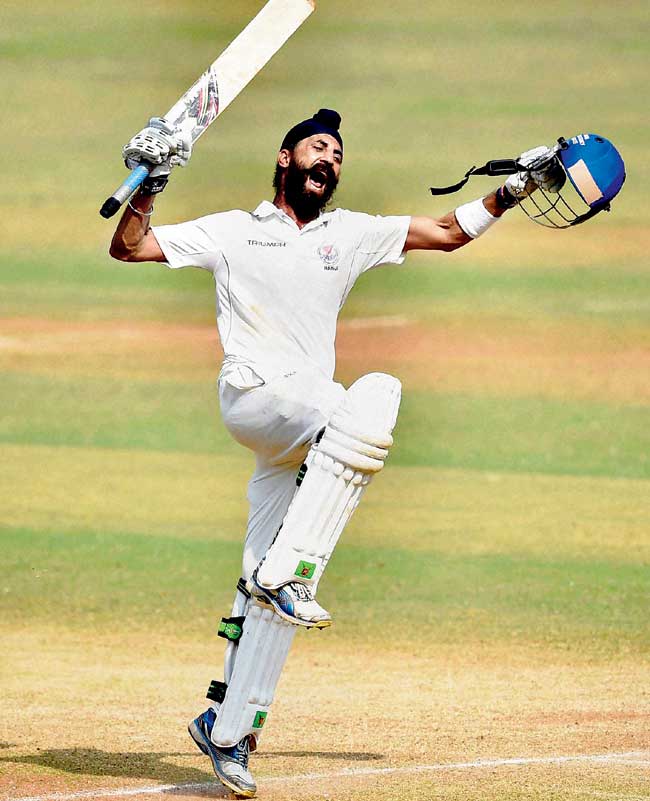 Jammu & Kashmir batsman Hardeep Singh celebrates his team