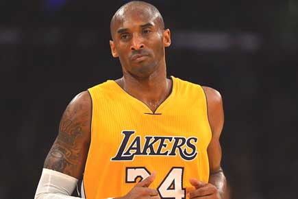NBA: Kobe Bryant scores 32 as Lakers hold off Kings