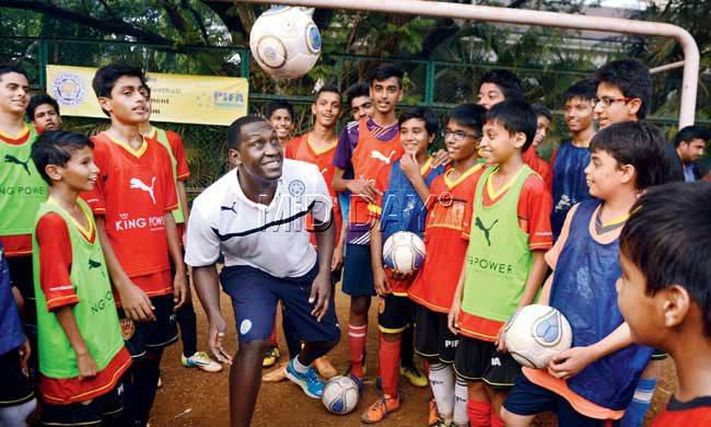 Former England and Liverpool footballer Emile Heskey heads the ball during a training session with kids from PIFA Elite Academy at Sacred Heart School in Santacruz yesterday. Pic/Atul Kamble