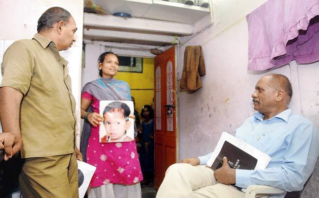 Faces lit up: Megha’s mother, Seema, and grandfather Ramesh Thakur with ACP Vasant Dhoble yesterday. Pic/Rane Ashish