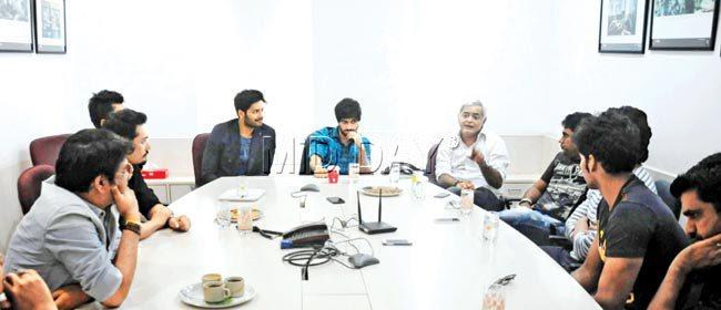 Hansal Mehta (fifth from right) makes a point as the others listen in.