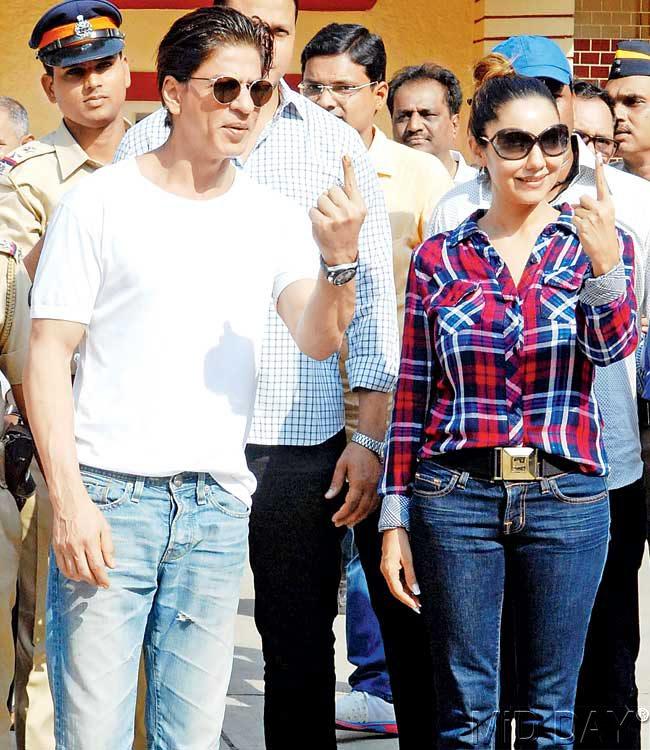 Shah Rukh Khan with wife, Gauri coming out of a polling station in Bandra after having cast their vote