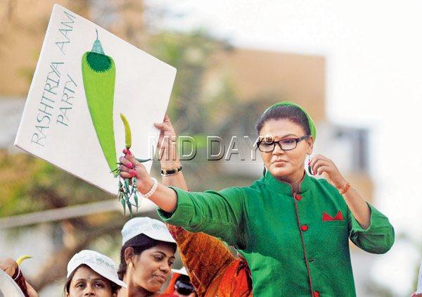 Green and bear it: Actress-turned-politician Rakhi Sawant, who floated her own political party for the Lok Sabha elections, on a campaigning trail in July  