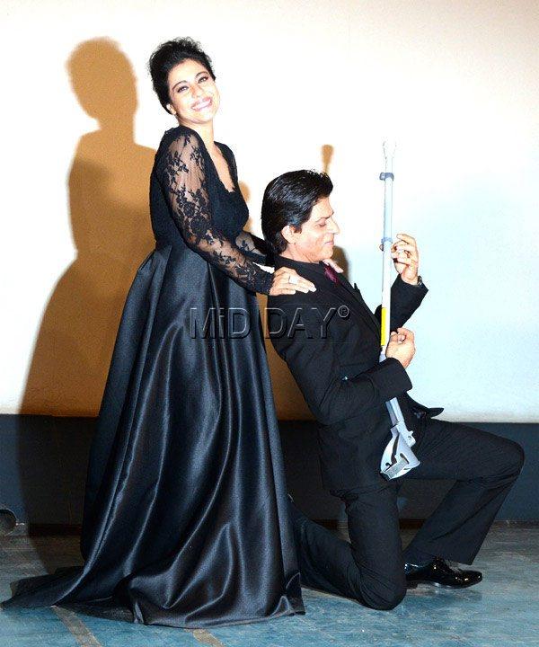 To many more years to come: Shah Rukh Khan tries to strum an injured Kajol’s crutch at the 1000th week celebration of their 1995 blockbuster Dilwale Dulhaniya Le Jayenge at Maratha Mandir