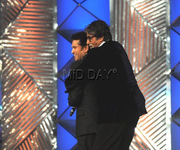 Gotcha!: Sachin Tendulkar seems happy to be caught unawares by Amitabh Bachchan at a Mumbai police event in January. When it’s Big B, who would mind a surprise grab like this?